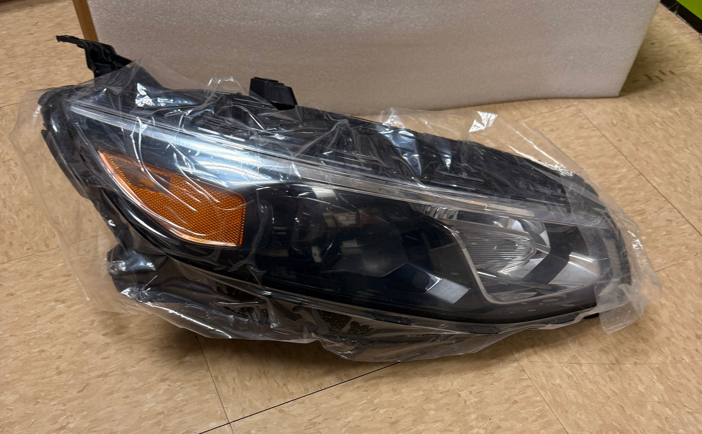 Front Right (Passenger Side) Halogen Headlight Assembly for a 2016–2018 Chevrolet Malibu.